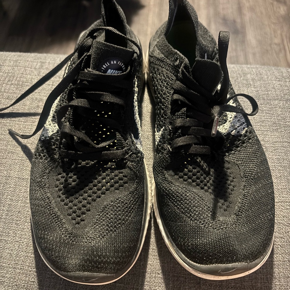 Nike Black Flyknit Athletic Shoes with White Accents